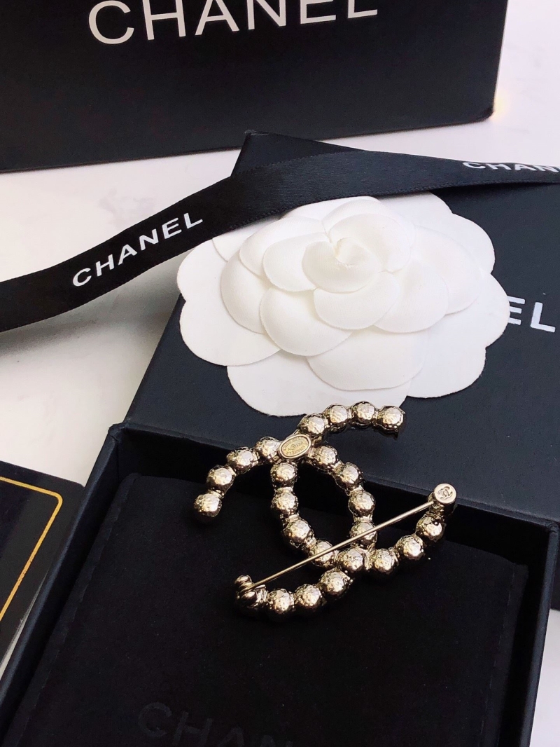 Ch**el brooches